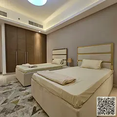 Luxurious and elegant two-bedroom apartment with a living room, fully furnished with brand new, high