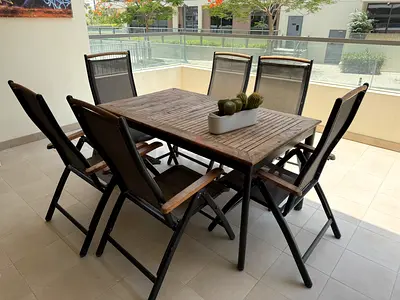 Outdoor Teak Dining Table with 6 Folding Mesh Chairs - Good Condition