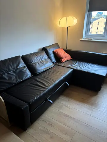 Black L-shaped Leather Sofa with Storage - Good Condition