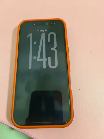 iPhone with orange protective case - good condition