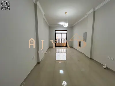 First-tenant 1BR apartment for annual rent in Al Mowaihat 3, Ajman. Free month, balcony, central AC, wardrobes, 2 baths, easy Dubai exit.