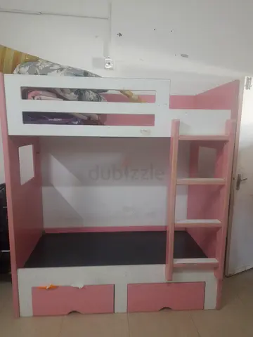 Pink and white kids bunk bed with 2 mattress and 2 storage — good condition
