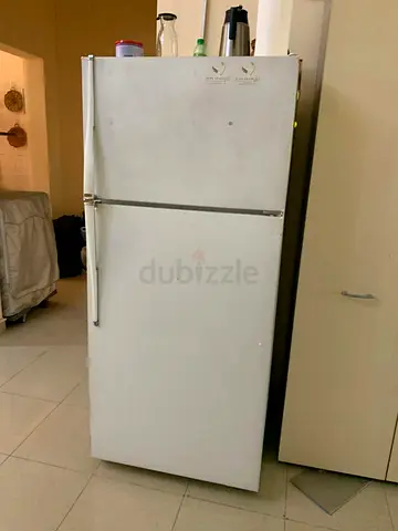 Used white top-freezer refrigerator - good working condition