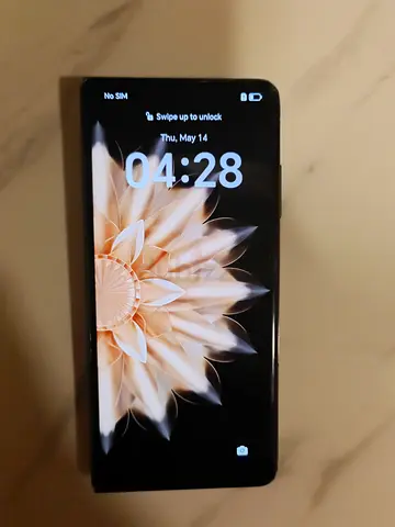 Used smartphone with cracked outer screen