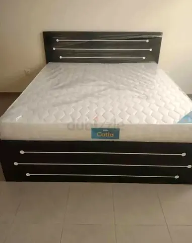 Queen bed frame with mattress - dark wood finish