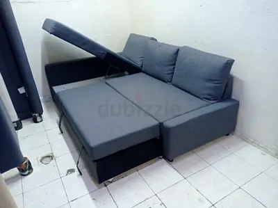 Grey L-shaped Sofa Bed with Storage - Good Condition