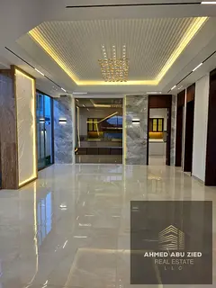 Villa in Al Yasmin facing Al Hamidiya Park, corner plot, 3 floors + roof, 6 master bedrooms, elevat