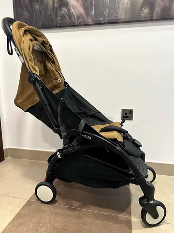 Lightweight black stroller - single wheel view, like new. Used once.