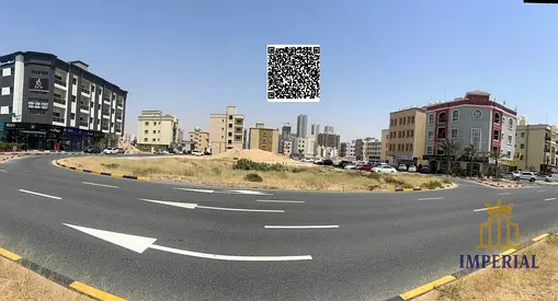Two adjoining plots of land on a corner (G+3) on the main road opposite Al-Raqayib, freehold