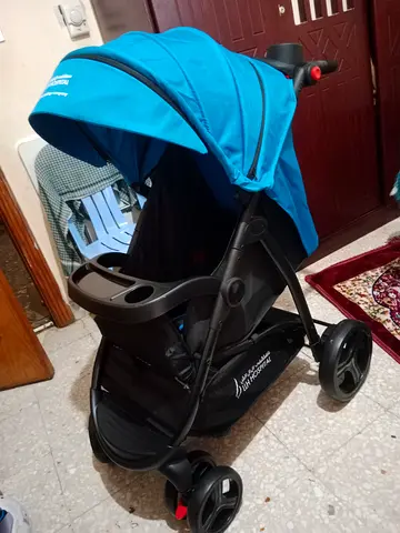 Lightly used blue single baby stroller - compact and comfortable