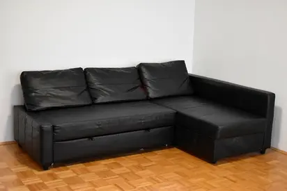 Black L-shaped Leather Sofa with Storage - Good Condition