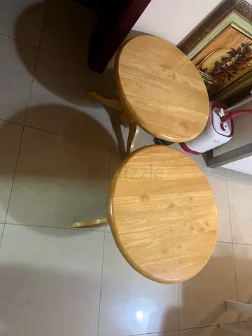 Pair of small round wooden side tables - light oak finish