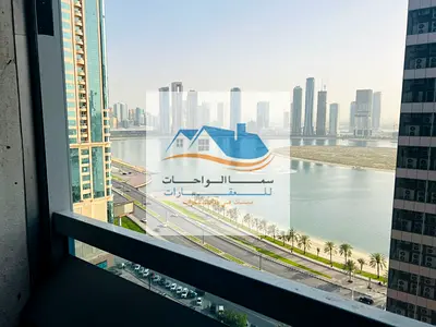 Al Khan Riviera Tower, a two-bedroom apartment with a living room, two bathrooms, a kitchen, and a