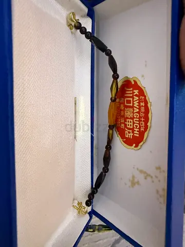 Vintage small carved bead bracelet in original box
