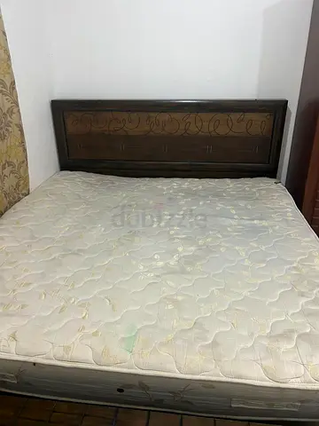 Used double bed frame with mattress — solid wood headboard