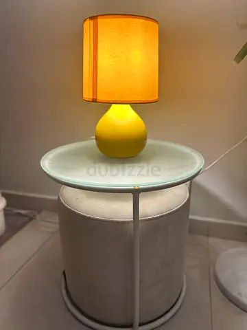 Small Round Side Table with Glass Top and Yellow Table Lamp