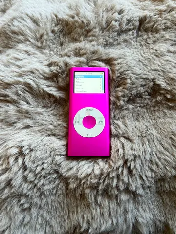 Pink Apple iPod Nano (4th gen) with charger and earphones