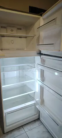 Well-maintained, largedouble-door refrigerator — spacious and clean