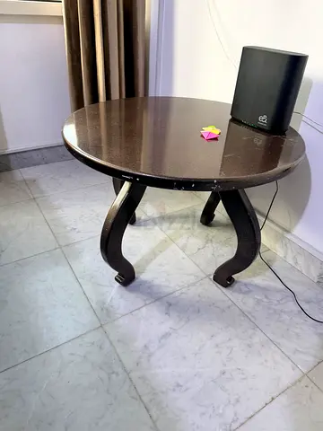Round wooden coffee/side table — dark finish, good condition