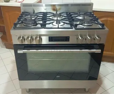 Beko 90x60cm Top Gas and Bottom Electric Cooking Range 6 Burner Model GM16425DXNG