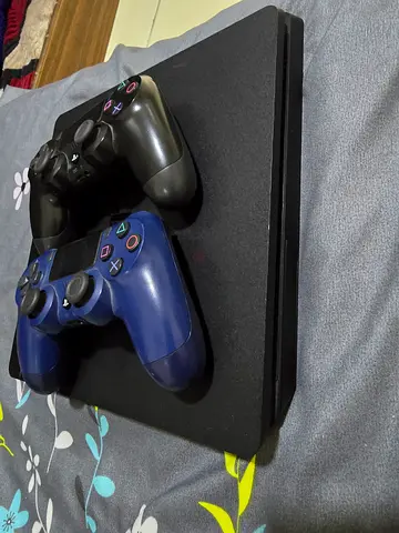 PlayStation 4 Slim with 2 DualShock 4 Controllers - Good Working Condition