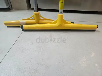 Pair of yellow floor squeegees — good condition