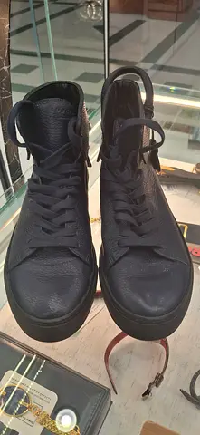 Used black high-top leather sneakers — good condition