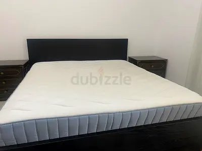 Queen bed frame with mattress and two bedside tables - dark wood brand new condition 180x200 IKEA