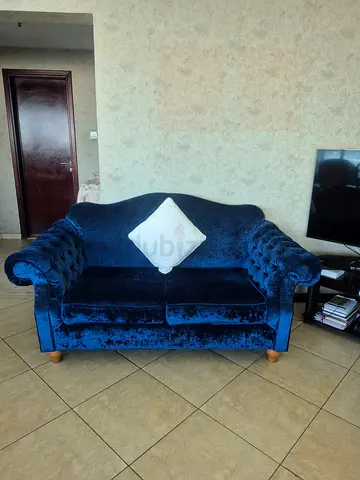 Two-seater blue velvet tufted sofa — good condition with 2 arm chairs
