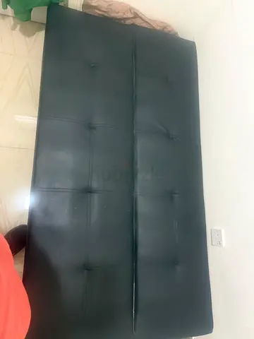 Black faux leather fold-out sofa bed (used)