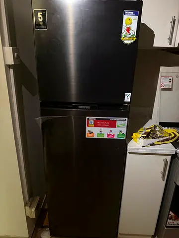 Used stainless steel refrigerator - top freezer, good working condition Geepas