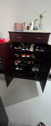 Dark wood shoe cabinet with doors and drawer - good condition