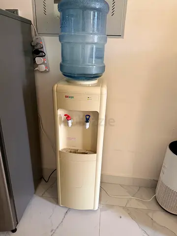 Used freestanding bottled water cooler/dispenser - beige