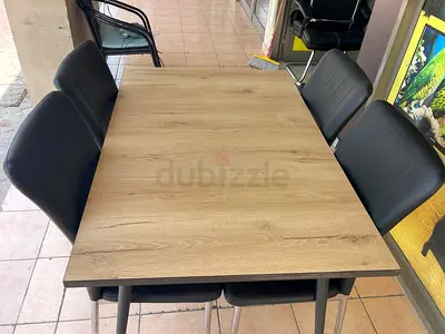 Wooden Dining Table with 6 Black Padded Chairs - Good Condition