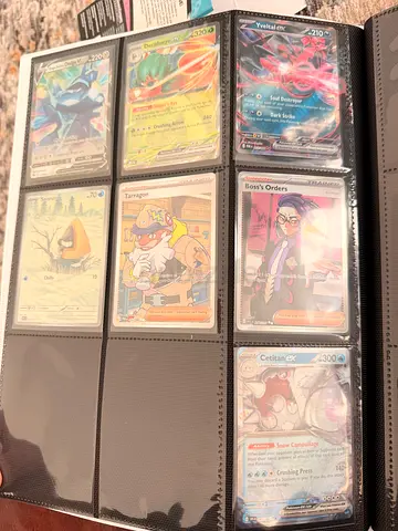 Collection of Pokémon Trading Cards in Binder (Rare/Trainer/EX Cards)