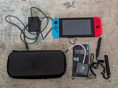 Nintendo Switch Console with Joy-Cons, Case and Accessories and tv adapter
