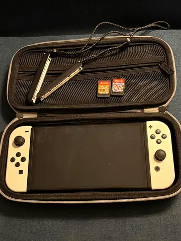 My Nintendo Switch (OLED) with case, two game cards and Joy-Con straps and all accessories