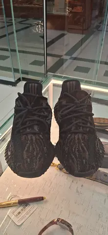 Used black athletic sneakers - size unknown, good condition