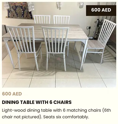Light wood dining table with 6 matching chairs - good condition