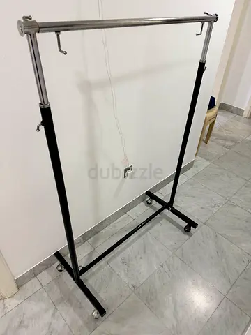 Adjustable Rolling Garment Rack - Metal Clothes Rail in Good Condition