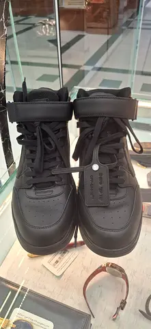 Pair of black high-top sneakers, lightly used