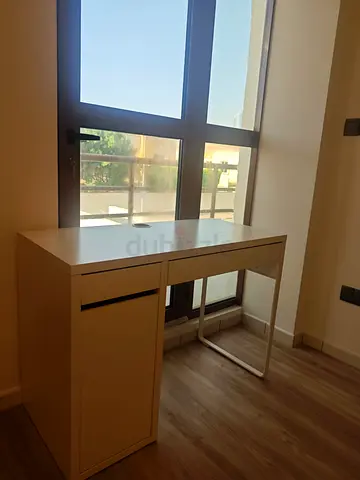 Compact white study desk with storage drawer and cabinet
