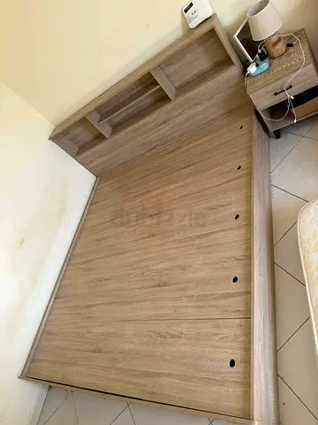 King-size wooden bed frame with built in headboard shelves - light oak finish