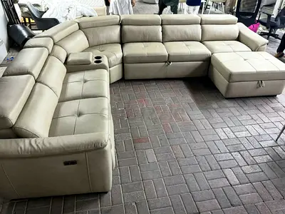 Large L-shaped leather reclining sectional sofa with ottoman (light beige)