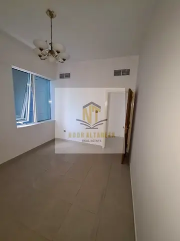 Apartment for annual rent in Al Taawun area, Sharjah. It consists of a bedroom, living room, bathroom, and kitchen with a practical design suitable fo