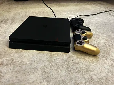 PlayStation 4 Slim with 3 DualShock Controllers - Good Working Condition