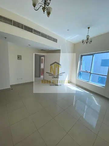A great opportunity to rent in Al Khan – Sharjah: a bedroom and living room with a swimming pool and free parking