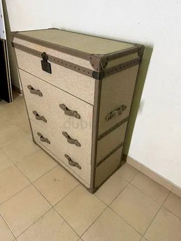 The One vintage travel chest-style chest of drawers in beige with leather handles