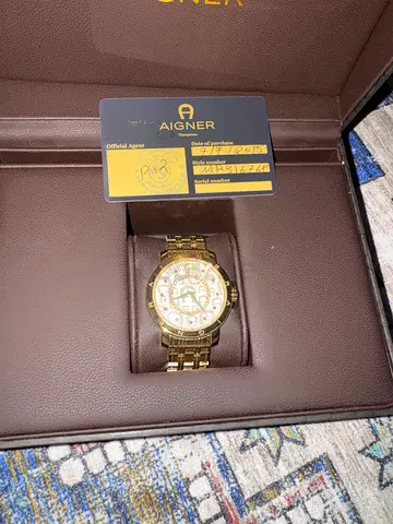 Gold-tone Aigner wristwatch in original box non negotiable