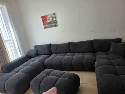 Large Dark Grey Modular L-Shaped Sofa with Ottoman - Good Used Condition